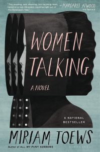 A pale teal book cover with three superimposed iterations of a woman's profile in a black bonnet. The title is Women Talking. The author is Miriam Toews.