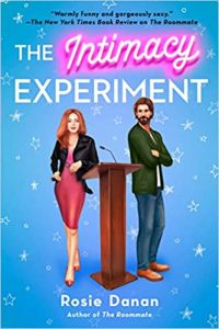 A blue book cover the says The Intimacy Experiment and Rosie Danan with a bearded man and a woman in a red dress standing on either side of a podium.