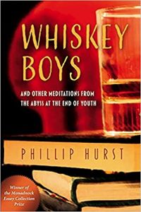 A book cover with a stack of books, a glass of whiskey on top, and a chair arm in the background. The title is Whiskey Boys, and the author is Phillip Hurst.